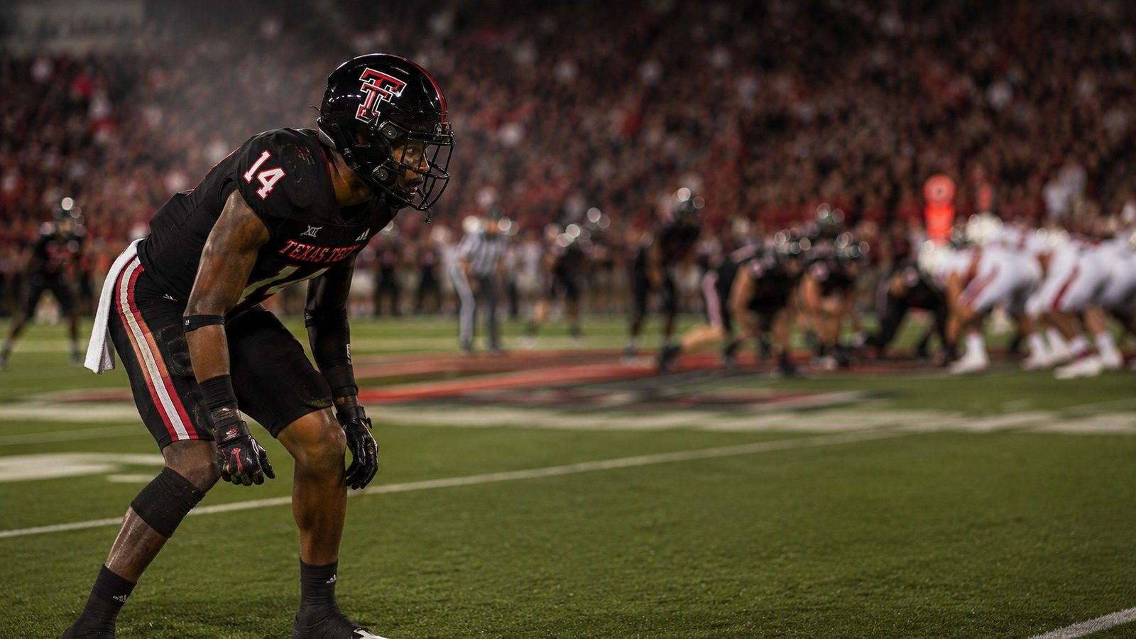 A cornerback in press coverage at the line of scrimmage